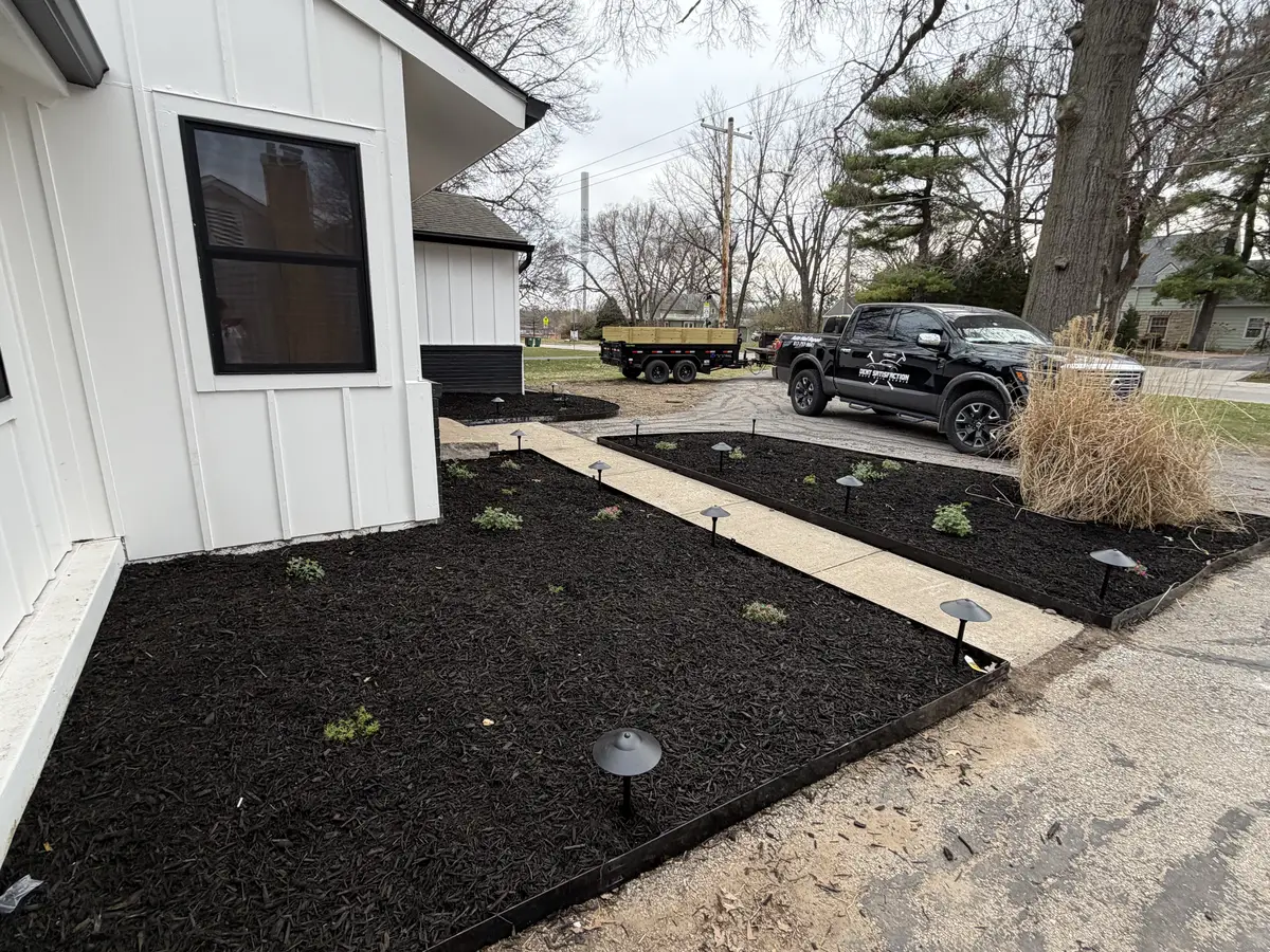 Side view mulch installation with landscape lighting and GC Signature truck on site — Gladstone MO